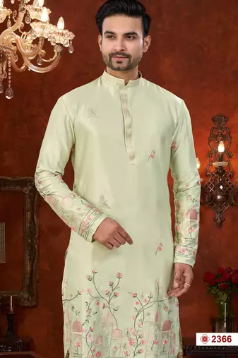 Pista green soft silk kurta pajama set with floral buti and hem embroidery—perfect for festive wear.