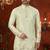 Pista green soft silk kurta pajama set with floral buti and hem embroidery—perfect for festive wear.