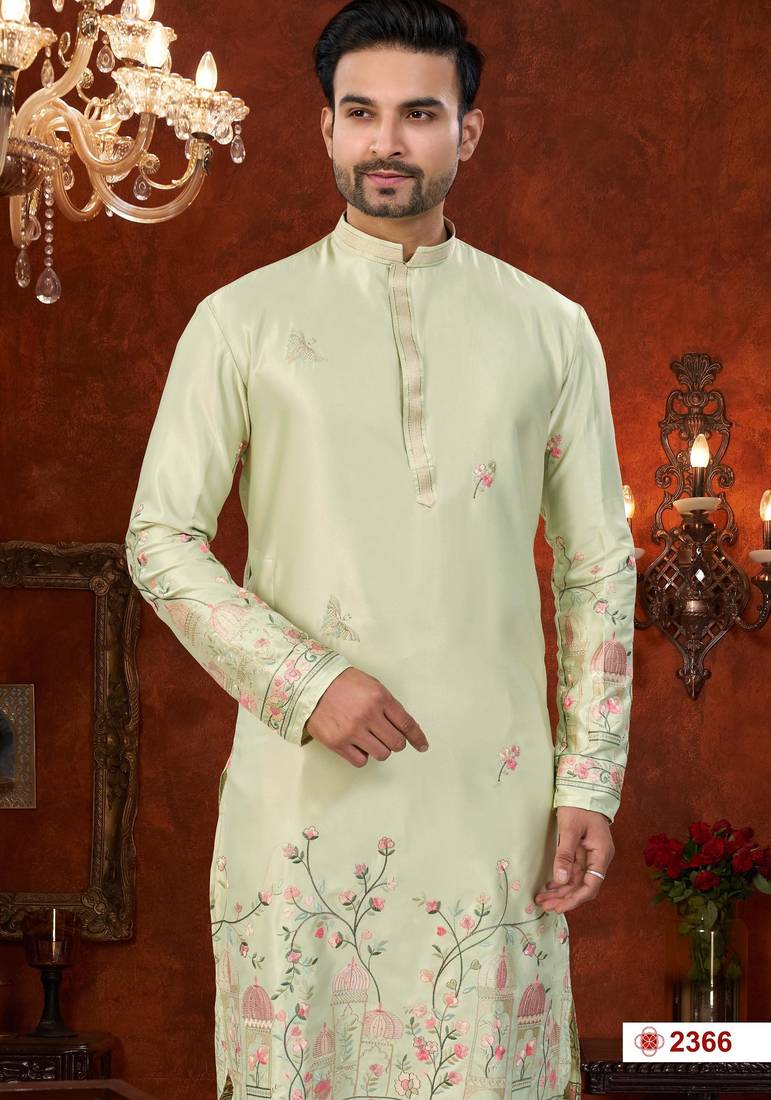 Pista green soft silk kurta pajama set with floral buti and hem embroidery—perfect for festive wear.