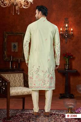 Pista green soft silk kurta pajama set with floral buti and hem embroidery—perfect for festive wear. 3