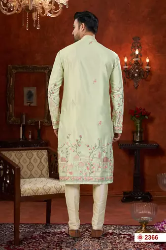 Pista green soft silk kurta pajama set with floral buti and hem embroidery—perfect for festive wear.