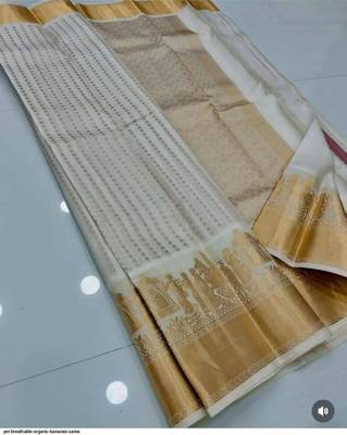 Off white silk blend jacuard work festival saree with unstitched blouse piece 1