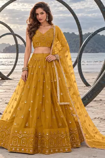 MUSTARD YELLOW NET THREAD WITH ZARI AND SEQUIN WORK FESTIVE LEHENGA CHOLI