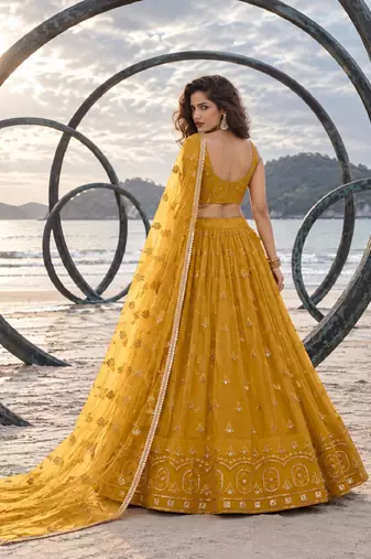 MUSTARD YELLOW NET THREAD WITH ZARI AND SEQUIN WORK FESTIVE LEHENGA CHOLI