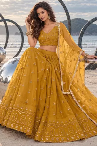 MUSTARD YELLOW NET THREAD WITH ZARI AND SEQUIN WORK FESTIVE LEHENGA CHOLI
