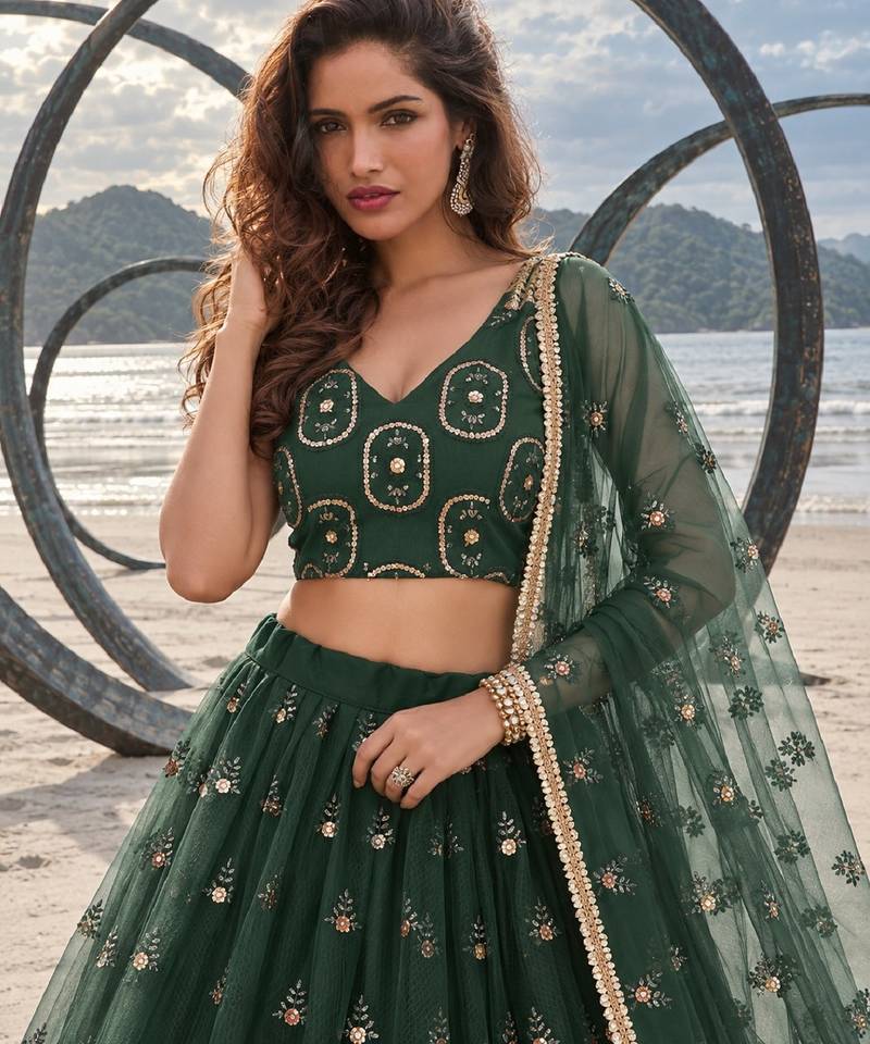 DARK GREEN NET THREAD WITH ZARI AND SEQUIN WORK FESTIVE LEHENGA CHOLI