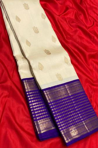 Off white blue silk blend jacuard work festival saree with unstitched blouse piece