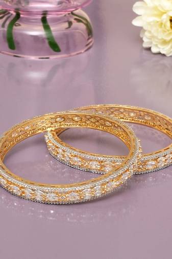 Orbiting leaf gold plated diamond bangles