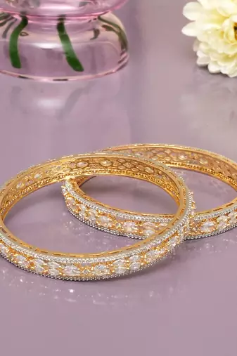Orbiting leaf gold plated diamond bangles