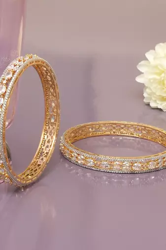 Orbiting leaf gold plated diamond bangles