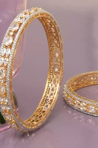 Orbiting leaf gold plated diamond bangles