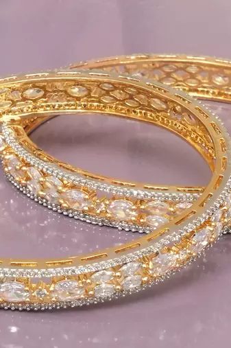 Orbiting leaf gold plated diamond bangles