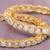 Ornate orbit solitaire gold plated bangles