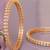 Graceful twirl gold plated diamond bangles