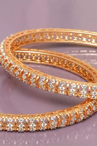 Graceful twirl gold plated diamond bangles