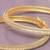 Regal row solitaire gold plated bangles
