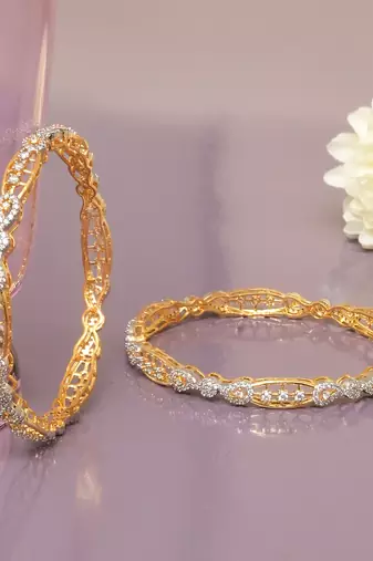 Swirling  solitaire gold plated diamond bangles