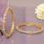 Swirling  solitaire gold plated diamond bangles