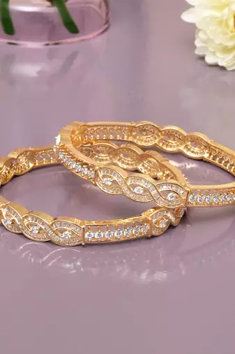 Radiant loop gold plated diamond bangles