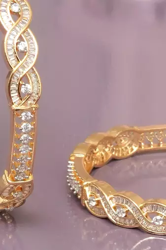 Radiant loop gold plated diamond bangles
