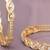 Radiant loop gold plated diamond bangles