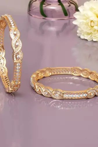 Radiant loop gold plated diamond bangles