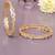Radiant loop gold plated diamond bangles