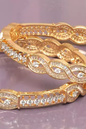 Radiant loop gold plated diamond bangles