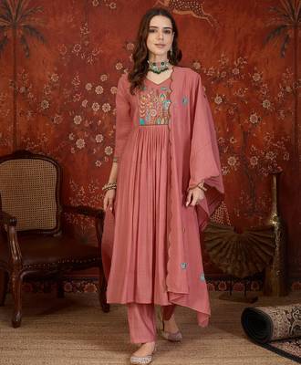 Peach color smart elegant mul cotton fabric smart embroidered suit for festive wear 1