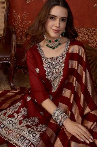 Maroon silk blend embroidered kurta set.