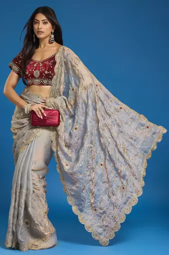 Grey tissue satin embroidered saree with unstitched blouse piece.