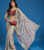 Grey tissue satin embroidered saree with unstitched blouse piece.