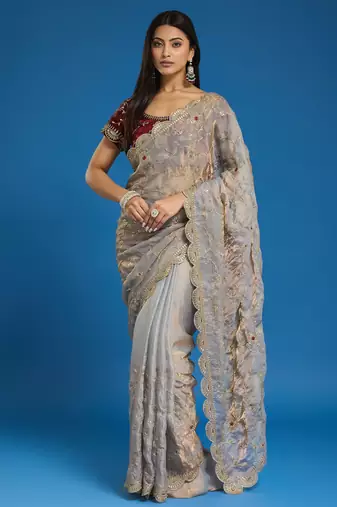 Grey tissue satin embroidered saree with unstitched blouse piece.