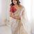 Beige tissue satin embroidered saree with unstitched blouse piece.