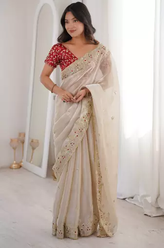 Beige tissue satin embroidered saree with unstitched blouse piece.