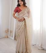 Beige tissue satin embroidered saree with unstitched blouse piece.