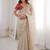 Beige tissue satin embroidered saree with unstitched blouse piece.