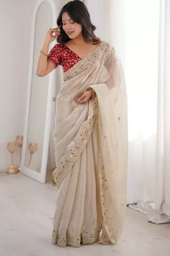 Beige tissue satin embroidered saree with unstitched blouse piece.