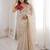 Beige tissue satin embroidered saree with unstitched blouse piece.