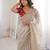 Beige tissue satin embroidered saree with unstitched blouse piece.