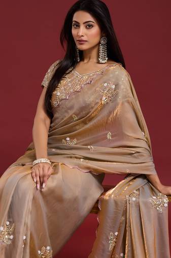 Beige tissue satin embellished saree with unstitched blouse piece.