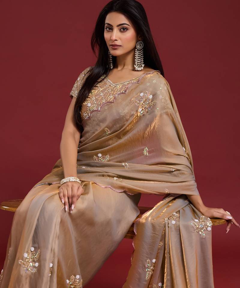 Beige tissue satin embellished saree with unstitched blouse piece.