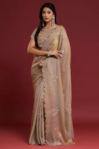Beige tissue satin embellished saree with unstitched blouse piece.
