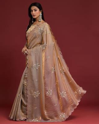 Beige tissue satin embellished saree with unstitched blouse piece. 5