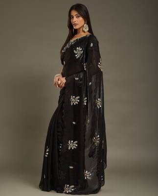 Black tissue satin embellished saree with unstitched blouse piece. 5