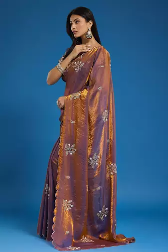 Brown tissue satin embellished saree with unstitched blouse piece.