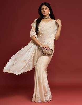 Cream tissue satin embellished saree with unstitched blouse piece. 1