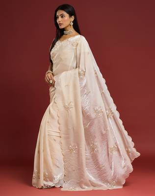 Cream tissue satin embellished saree with unstitched blouse piece. 5