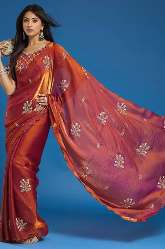 Orange tissue satin embellished saree with unstitched blouse piece.