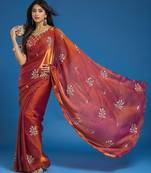 Orange tissue satin embellished saree with unstitched blouse piece.